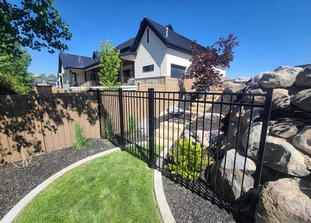 Iron Fence with House on The Hill