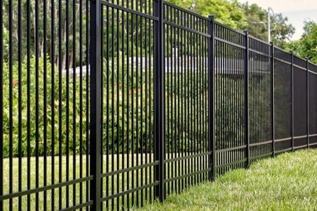 Iron Fence with House on The Hill
